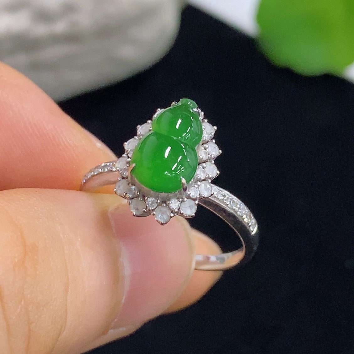 Jadeite gourd inlay ring by HKHQ featuring 18K gold and diamond accents, showcasing intricate craftsmanship and elegant design.