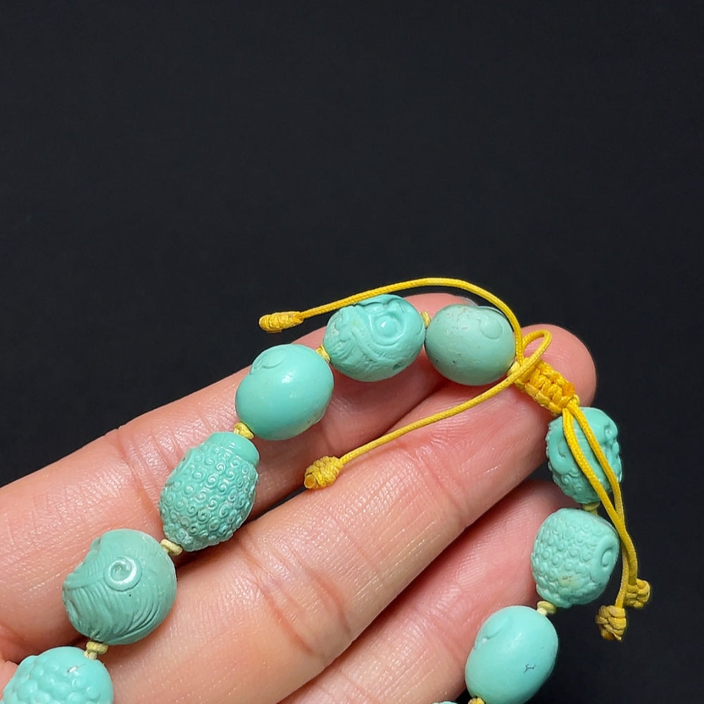Turquoise bracelet by HKHQ featuring polished round beads arranged in a stylish bracelet design.
