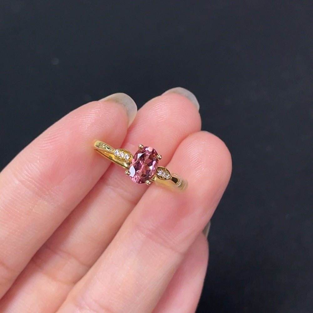 18K gold tourmaline ring by HKHQ featuring a vibrant green gemstone set in a sleek, elegant band.
