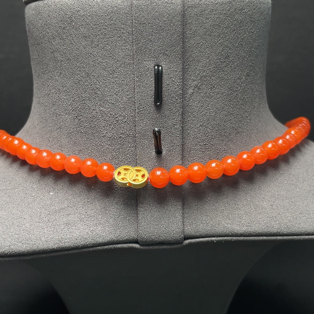 Red agate bead strand necklace with 18K gold accents, featuring tourmaline and pearl details, from HKHQ.