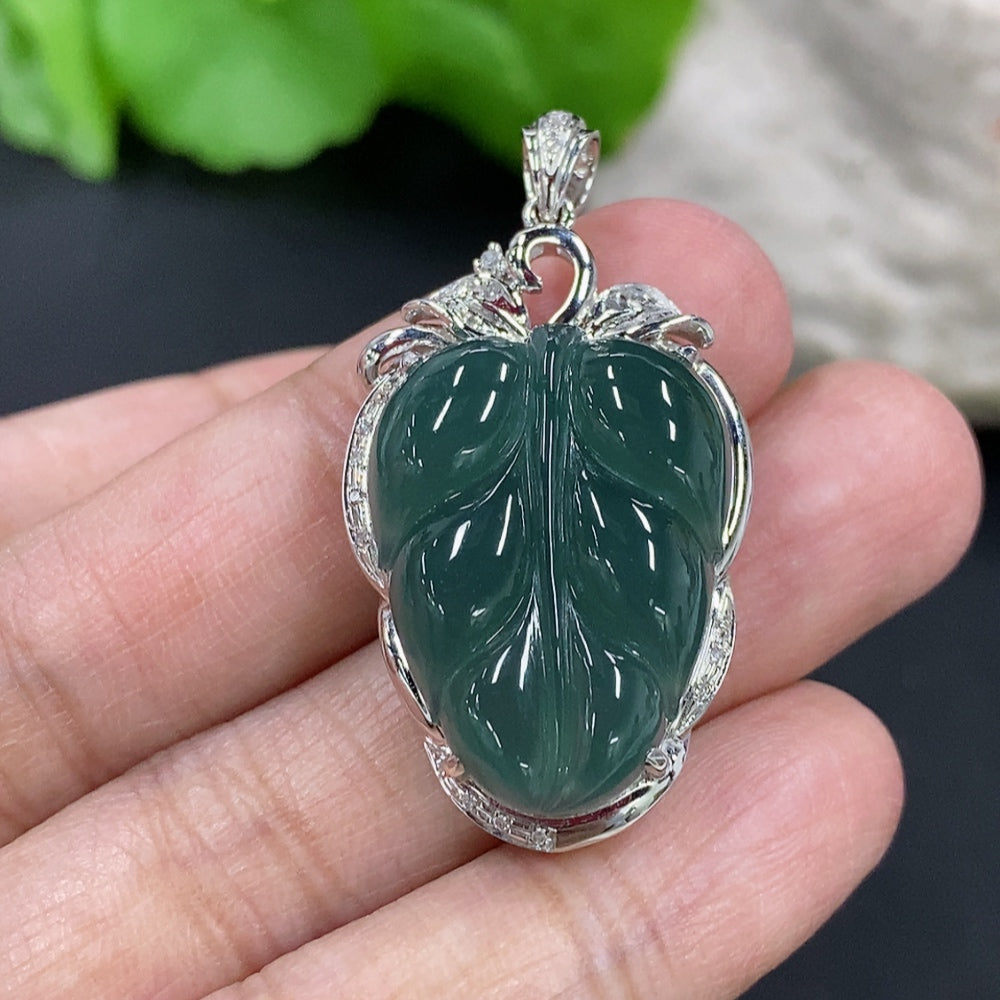 Jadeite leaf inlay necklace by HKHQ featuring 18K gold accents and diamond details, showcasing a delicate and elegant jewelry piece.