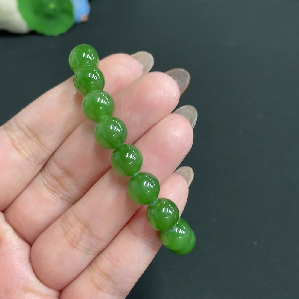 Hetian Jade Jasper bracelet with 9.3mm beads, weighing 24.1g, featuring smooth, polished jade stones from HUILIU HQ.