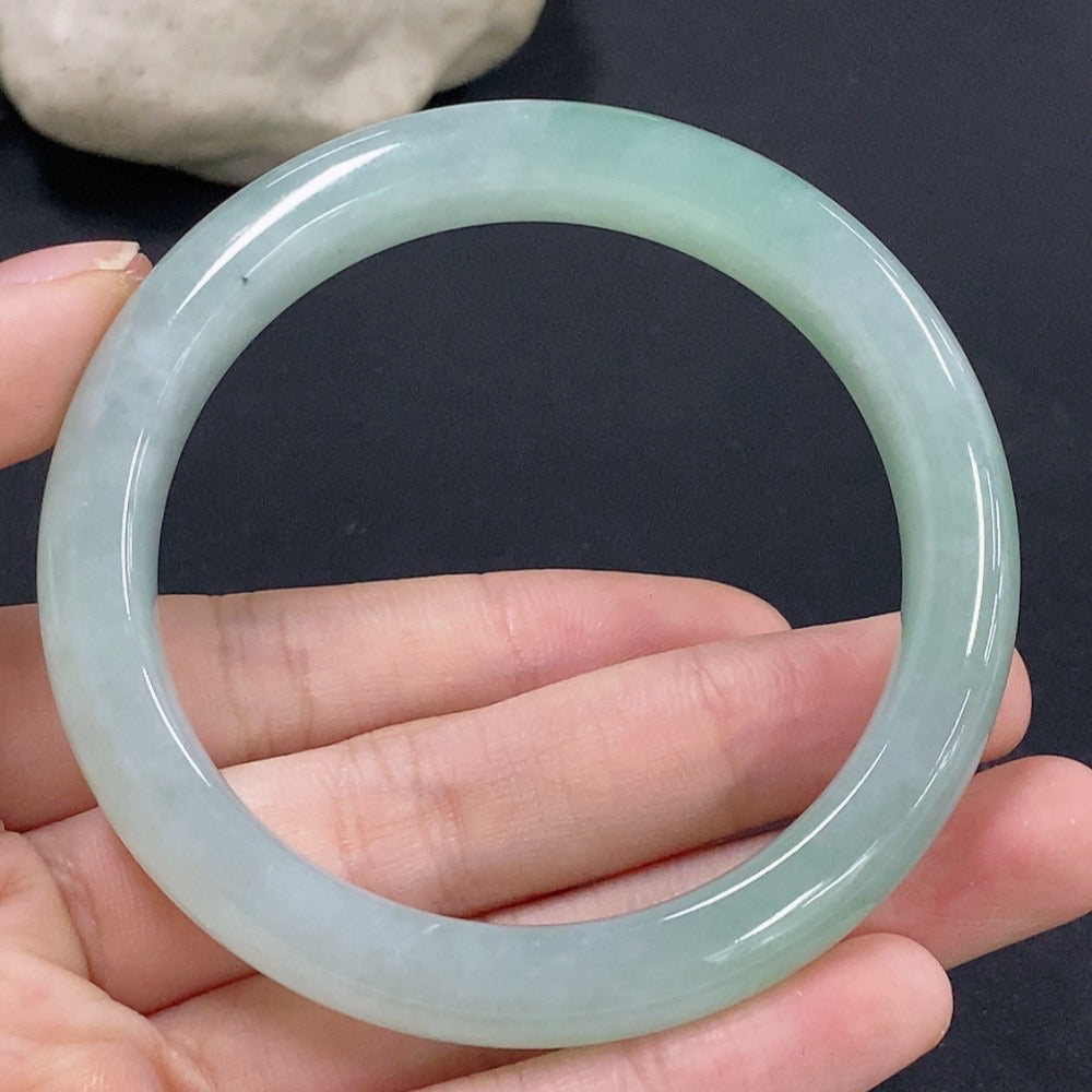 HKHQ jadeite round bracelet, size 55, weighing approx. 49.08g, showcasing smooth, polished green jade stones.