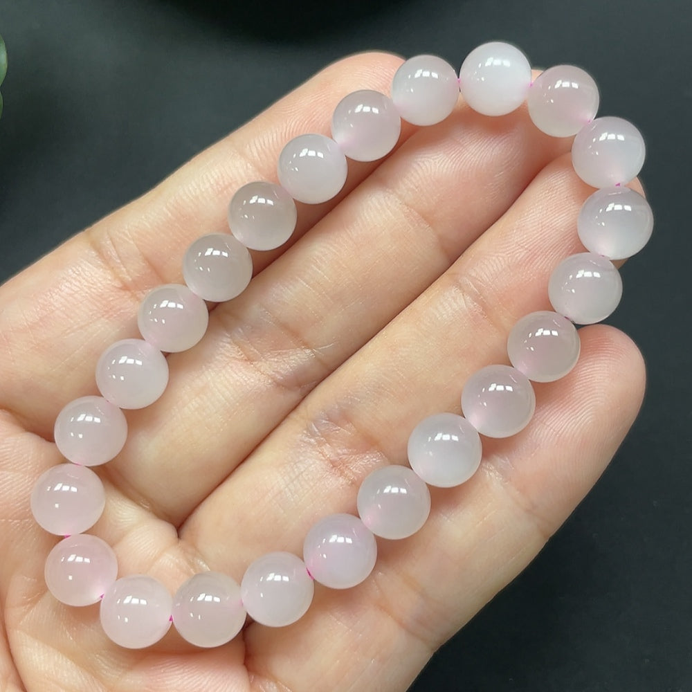 Hetian jade bracelet with 7.7mm smooth jade beads from HKHQ, showcasing a delicate and elegant jewelry accessory.