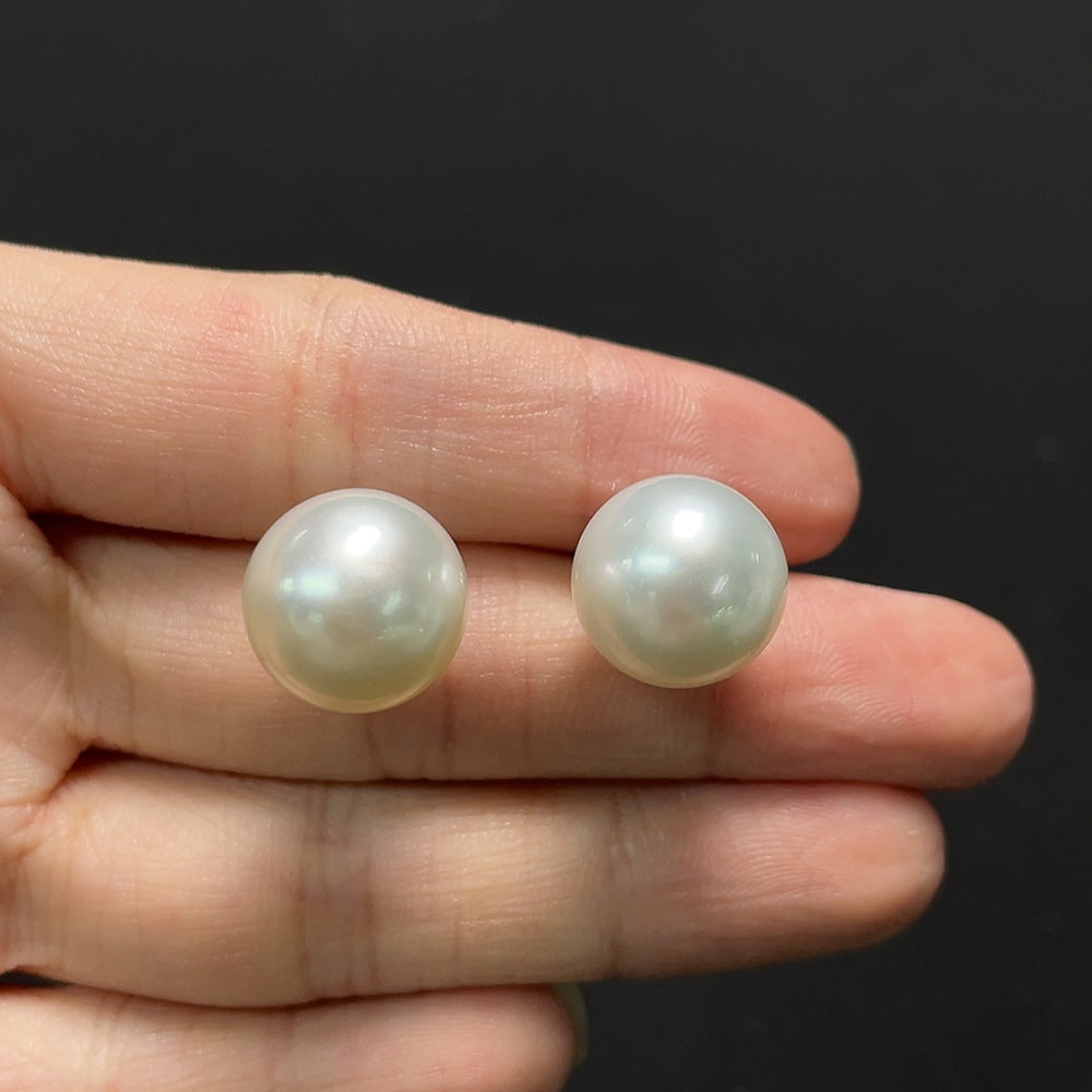 Saltwater pearl earrings with 18K gold hooks from HKHQ, featuring lustrous pearls and elegant jewelry design.