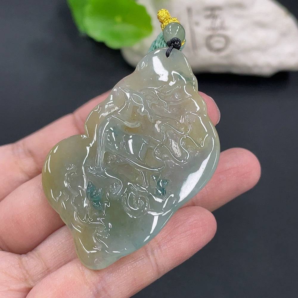 Huiliu Jadeite pendant featuring a polished, green jade teardrop design on a simple cord, showcasing craftsmanship and natural beauty.