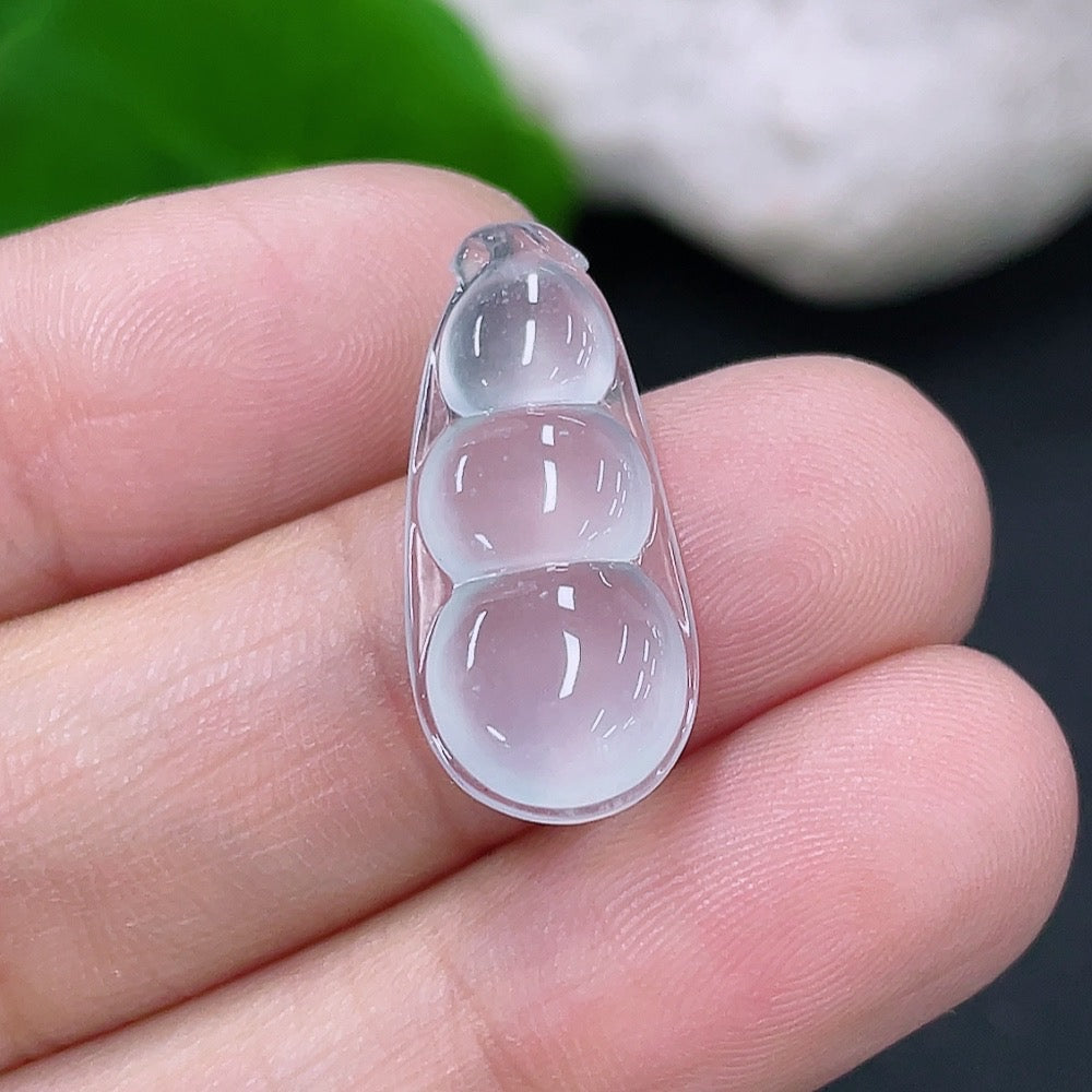 Jadeite inlaid fortunate bean pendant from HKHQ, weighing approx. 1.35g, featuring intricate jade inlay work.