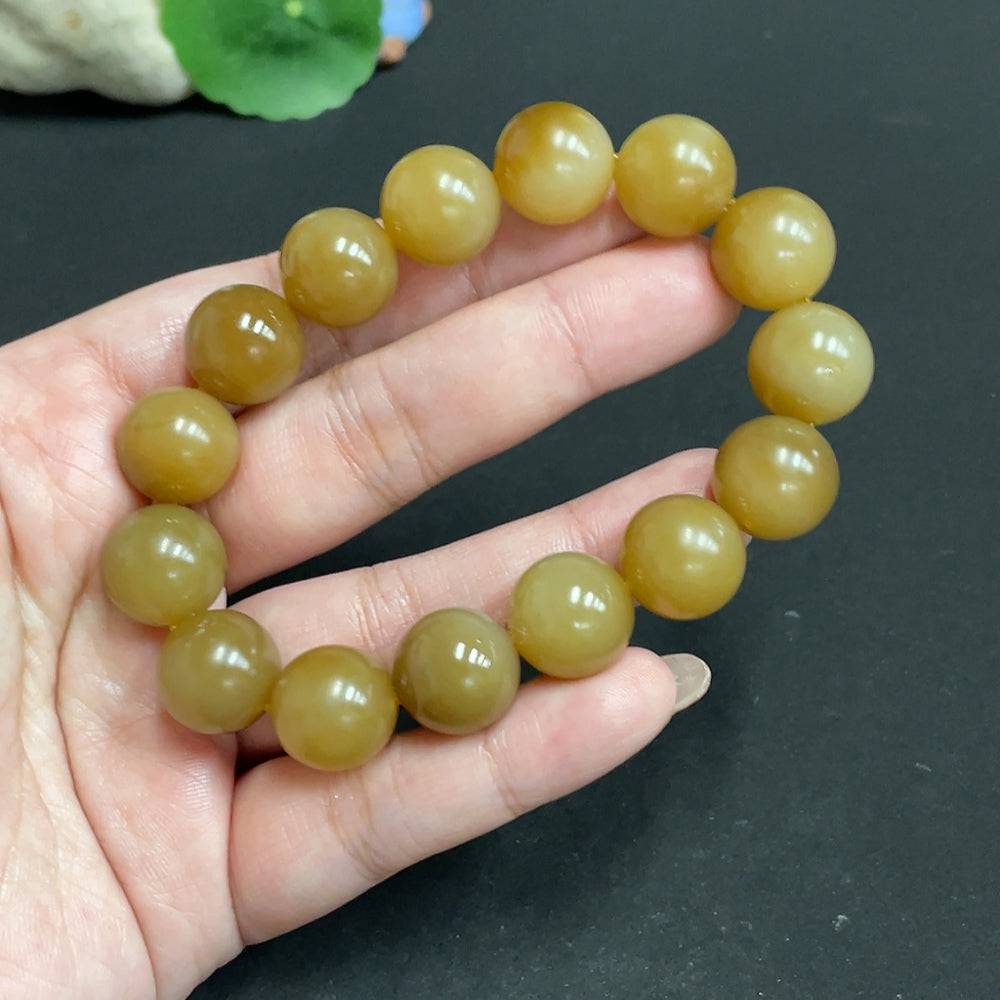 Hetian jade bracelet with 13.9mm beads and a total weight of 65.4g, crafted by HUILIU HQ, showcasing smooth, polished jade stones.