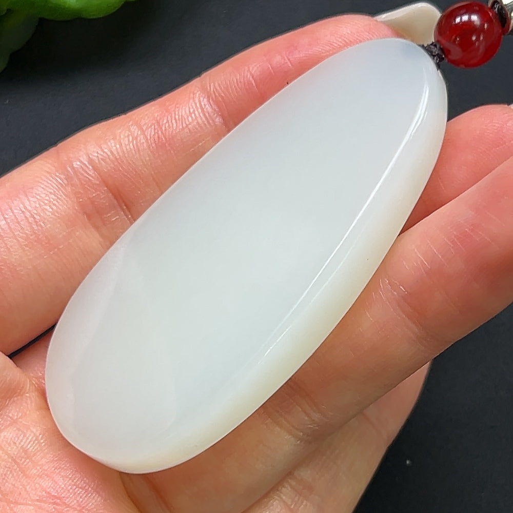 Hetian Jade plain pendant necklace with rope chain, crafted by HKHQ, showcasing a smooth, oval jade pendant on a stylish rope chain.