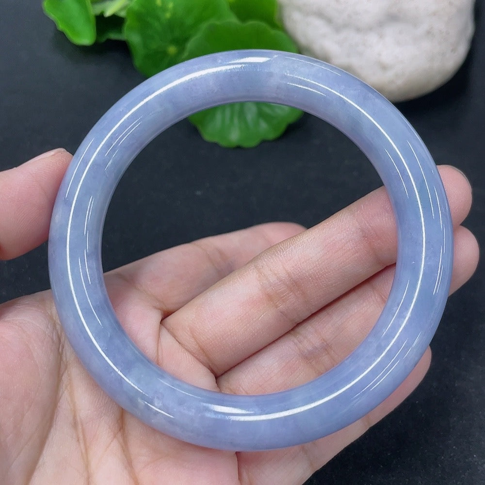Jadeite round bangle in size 56mm, weighing approximately 54g, showcasing smooth, polished jade jewelry with a glossy finish.