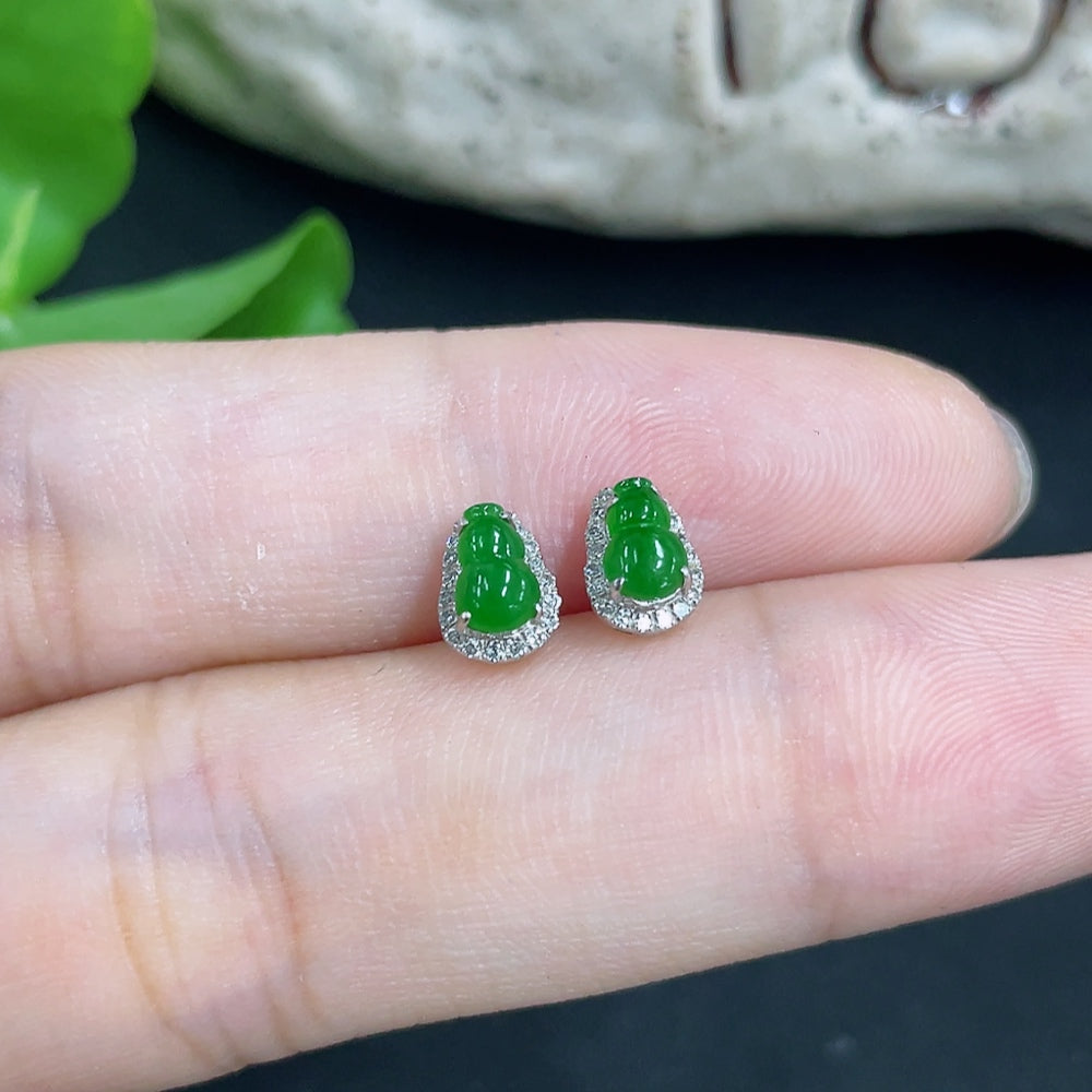 Jadeite earrings with 18k gold and diamond accents, featuring smooth green jade stones and intricate gold detailing.