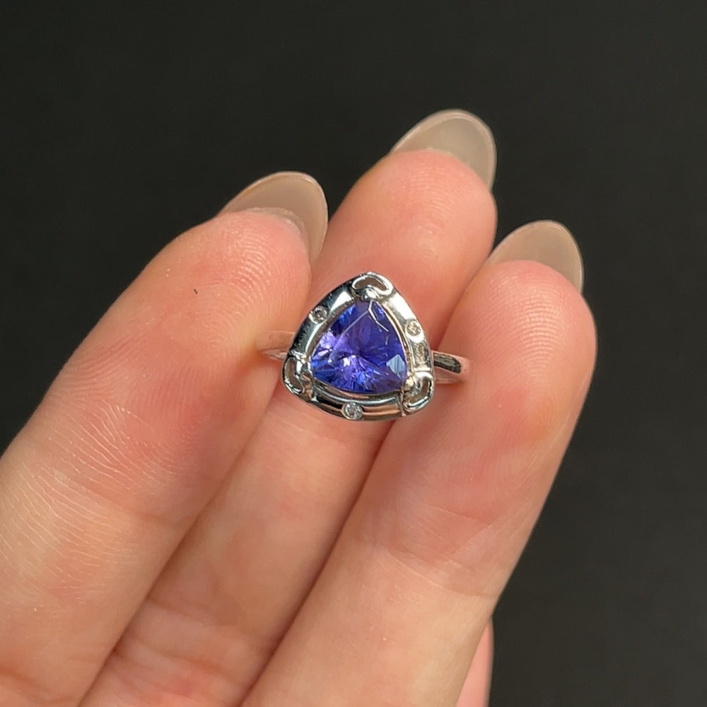Tanzanite gemstone ring in 18K gold, size 6.5, featuring a vibrant blue-purple tanzanite stone on a gold band.