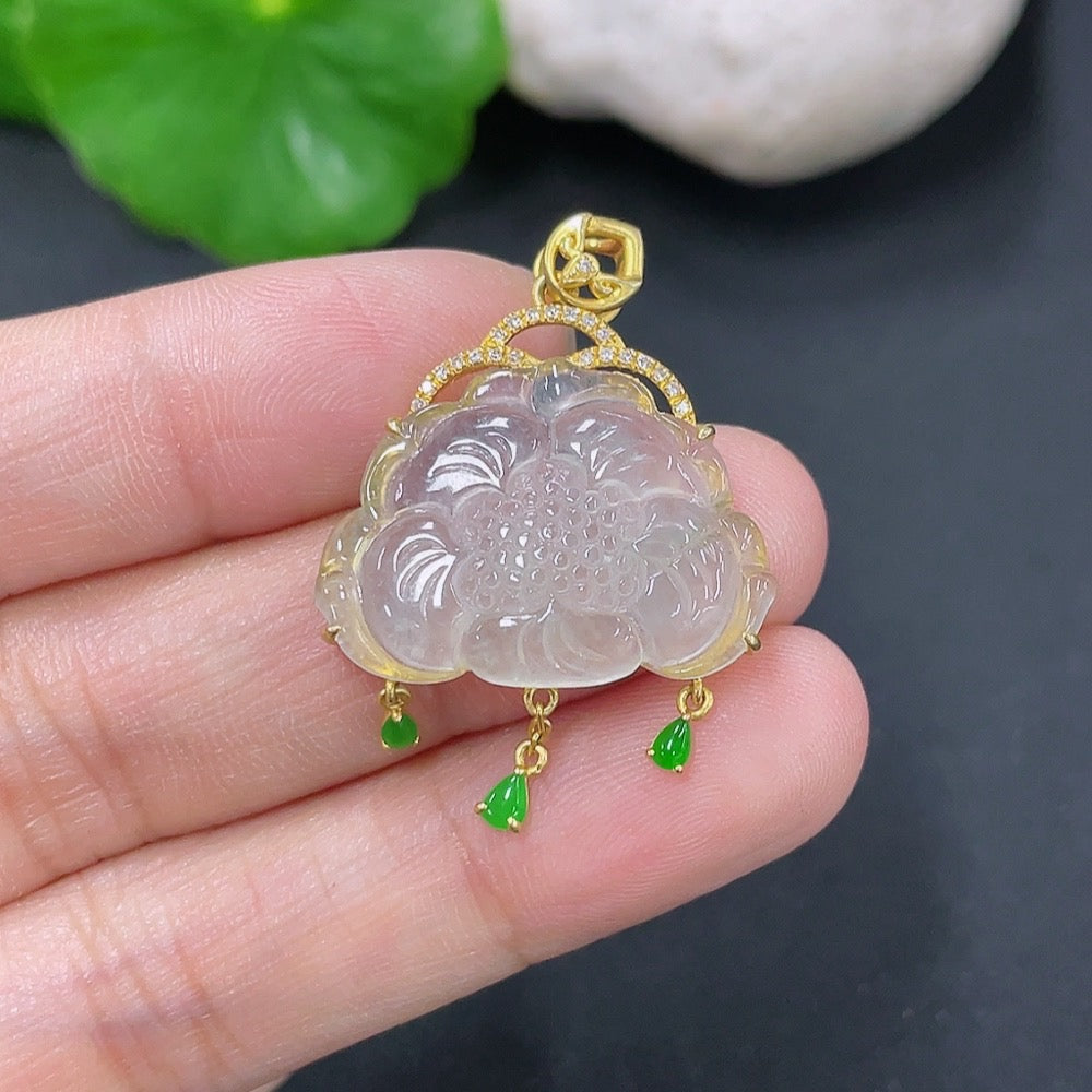 Jadeite inlaid pendant with diamond accents in 18K gold, showcasing intricate craftsmanship and elegant design.
