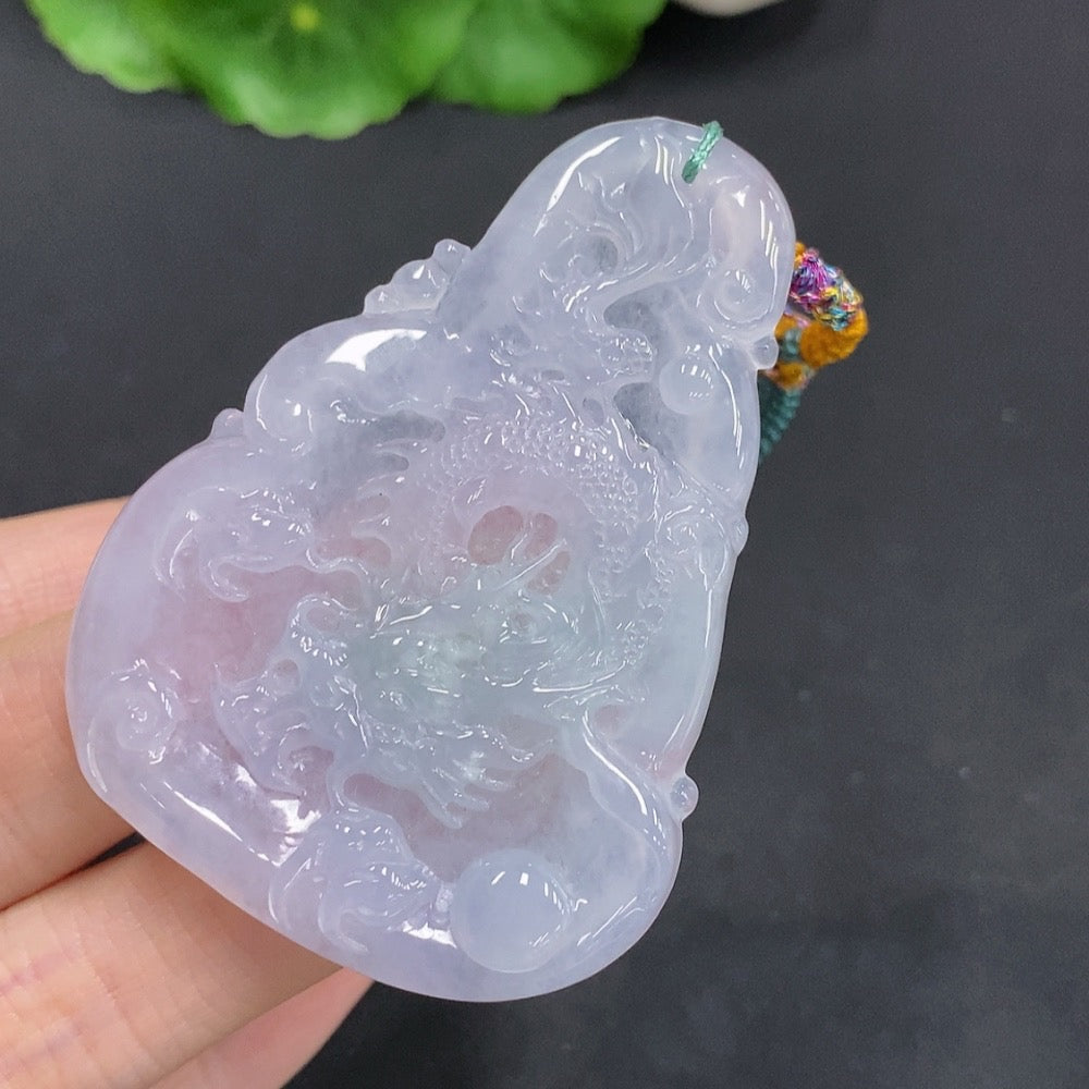 Huiliu Jadeite Dragon pendant soaring over the four seas, detailed green jade jewelry with intricate carving design.