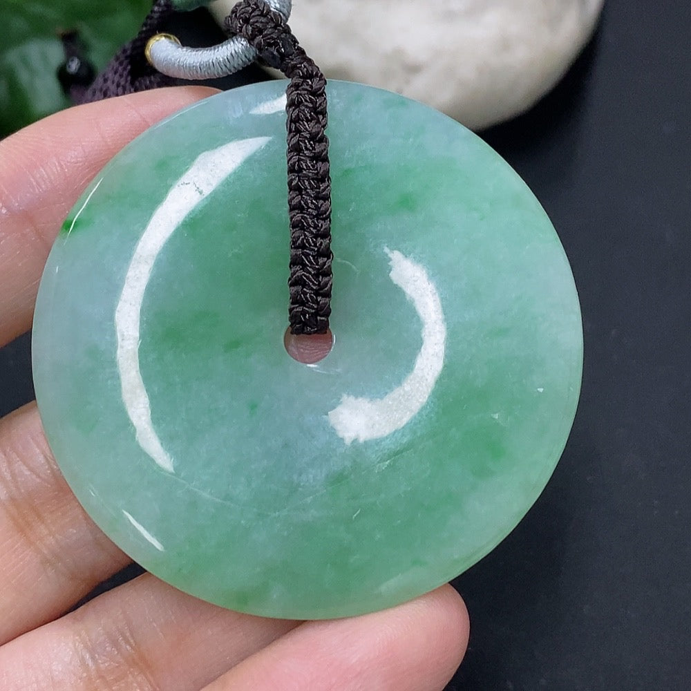 Jadeite pendant featuring a Peace Knot design, weighing 28.34g including cord, crafted by HKHQ.