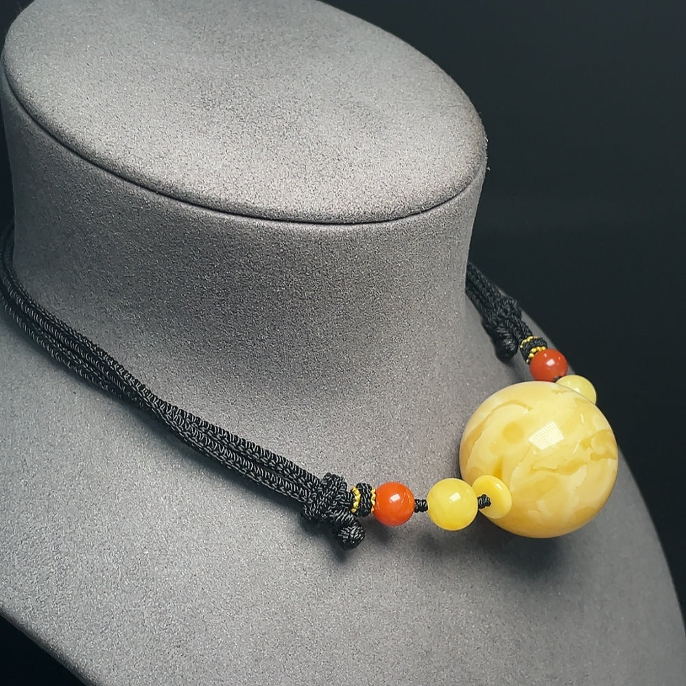 Amber Beeswax Pendant, . (including rope), Size . 33mm, with Southern Red Agate | Huiliu Certified