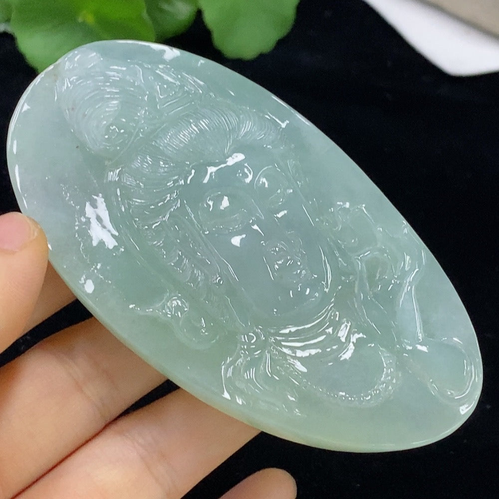 Huiliu Jadeite Guanyin pendant, carved jade deity jewelry, certified by HUILIU HQ, featuring intricate details on smooth jade surface.