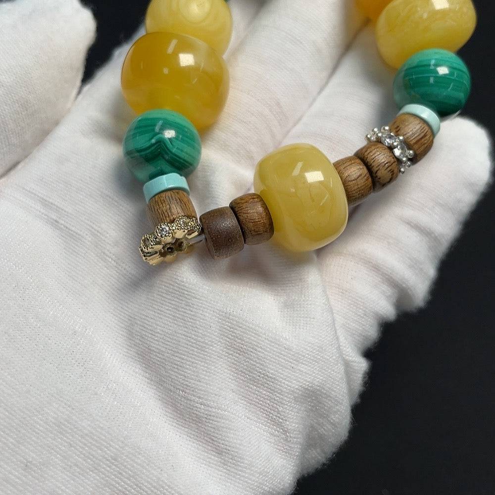 Amber Beeswax bracelet by HUILIU HQ featuring a 20.8mm amber bead with natural matching stones on a non-setting design.