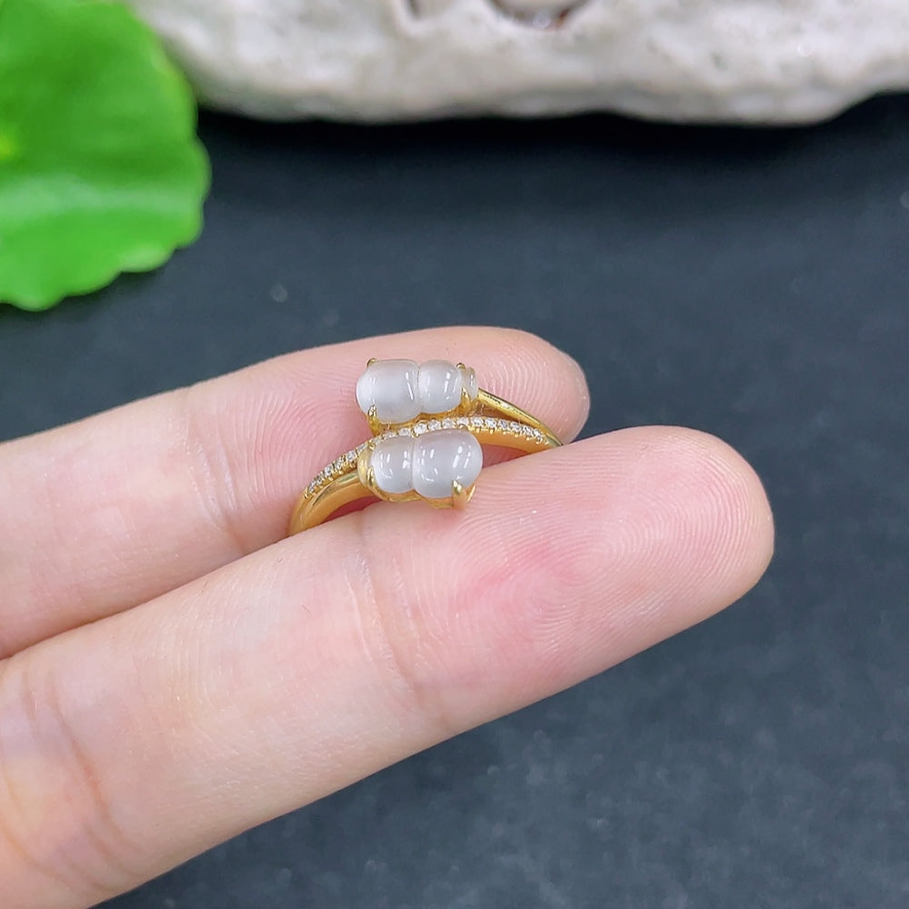 Elegant jadeite ring with 18K gold band and diamond side stones, showcasing a luxurious jewelry design from HKHQ.