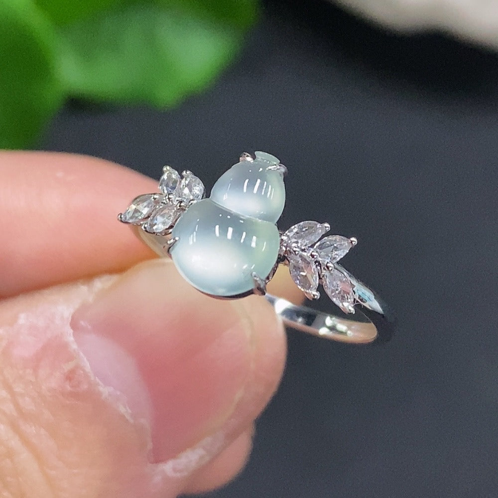 Jadeite gourd ring by HUILIU HQ with inlaid jade, 18k gold, diamond accents, size 15, weighing about 1.7g.
