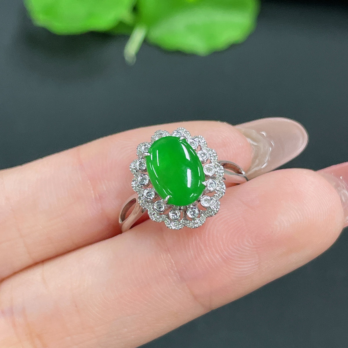 Jadeite ring with 18k gold band inlaid with diamonds, size 14, weighing approximately 2.95 grams, by HKHQ.