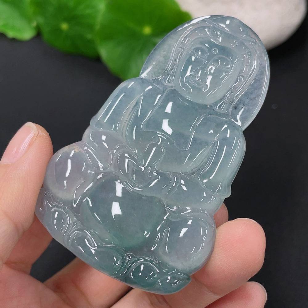 Jadeite Guanyin pendant from HUILIU HQ, showcasing detailed carving of the Bodhisattva figure on smooth green jade.