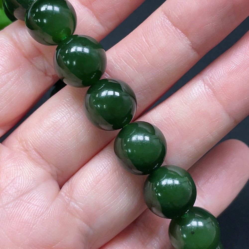 HKHQ Hetian Jade bracelet featuring 11.9mm smooth jade beads, total weight approximately 45.24g, displayed on a neutral background.