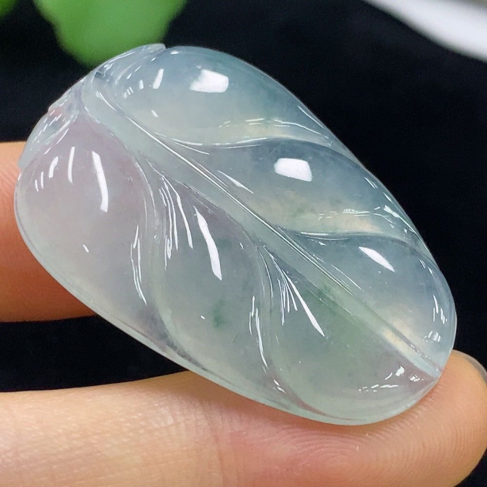 Jadeite leaf pendant from HUILIU HQ with intricate leaf design, weighs approximately 9.95g, showcasing smooth green jade craftsmanship.