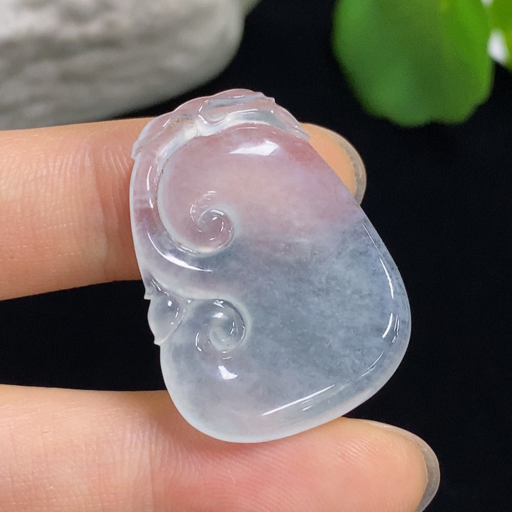 Jadeite Ruyi carving jewelry with inlaid setting, showcasing detailed craftsmanship and vibrant green jadeite from HKHQ.