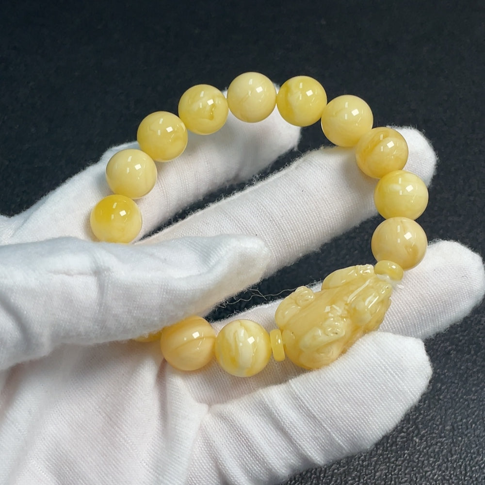 Amber and beeswax bracelet with 11.1-14.2mm beads, handcrafted by HUILIU HQ, featuring warm amber tones and natural textures.