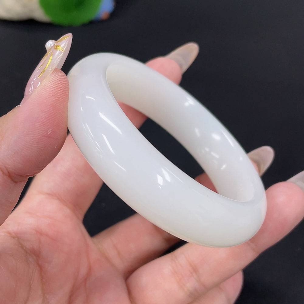 Huiliu certified Hetian jade round bracelet featuring smooth, polished jade beads in a natural green hue.