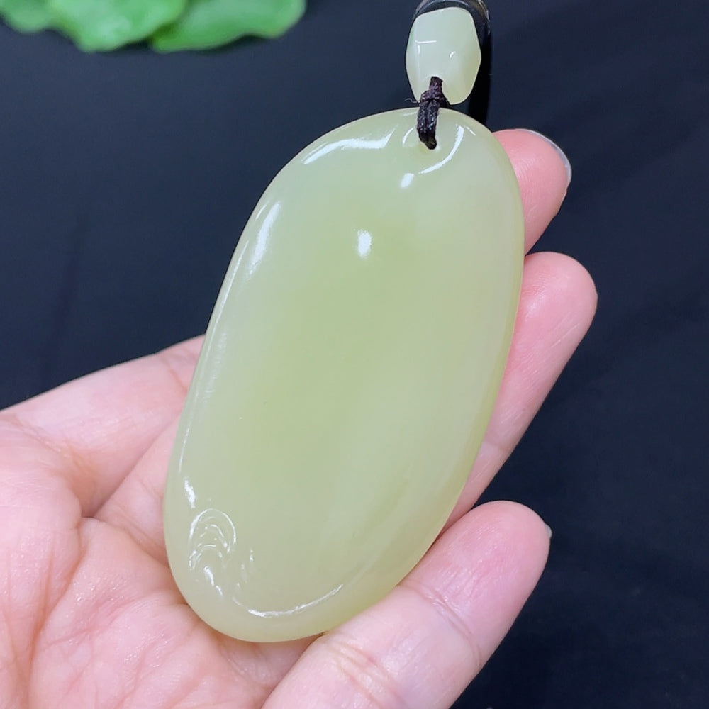 Elegant Hetian Jade freeform pendant necklace by HKHQ showcasing smooth, polished jade with unique organic shape.