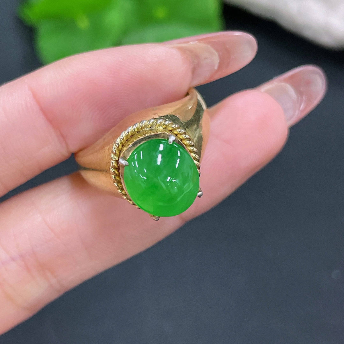 Jadeite cabochon from HUILIU HQ, non-gold, approximately 12.26g, showcasing smooth, polished green jade gemstone.