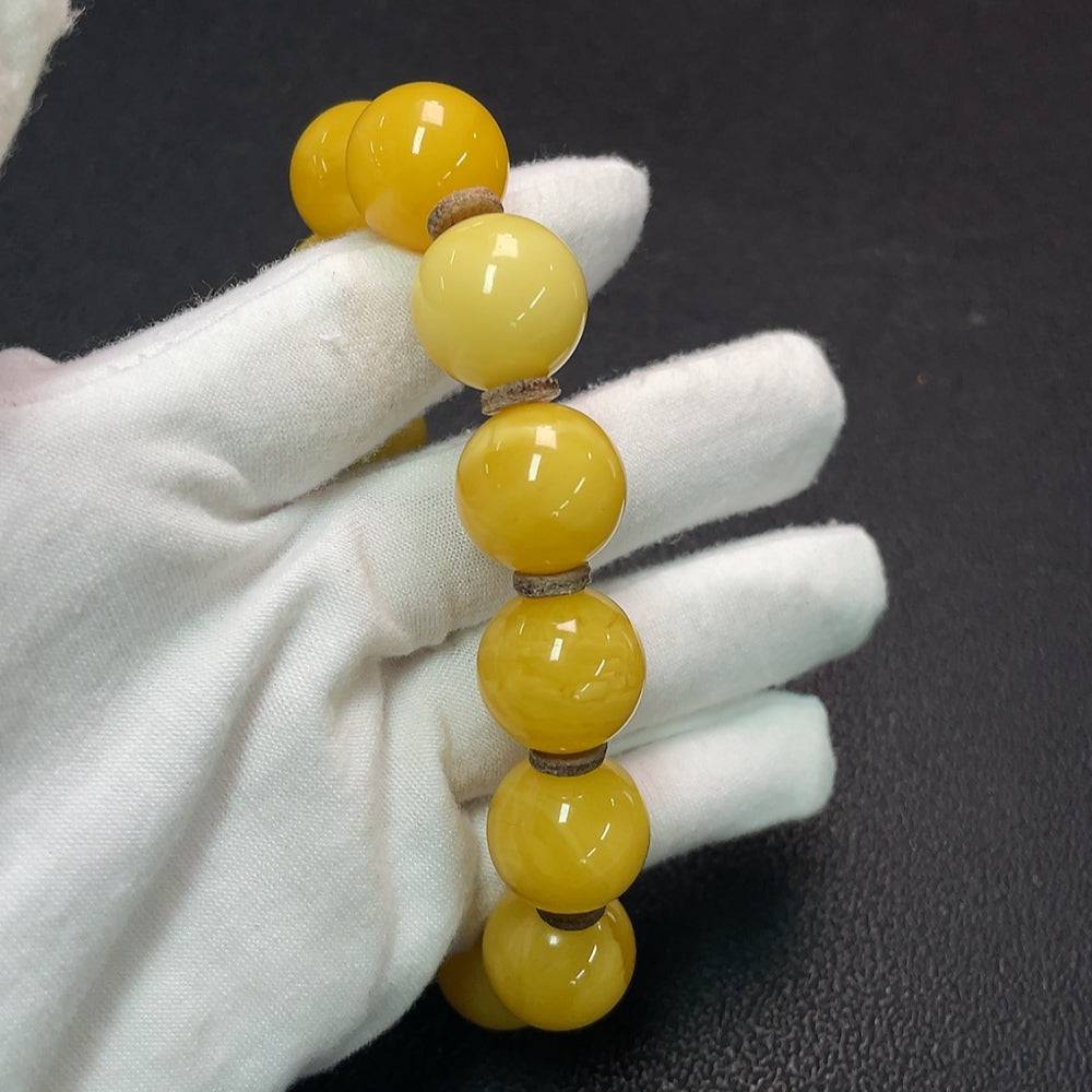 Amber Beeswax bracelet by HUILIU HQ featuring a 16.1mm amber bead with natural beeswax finish.