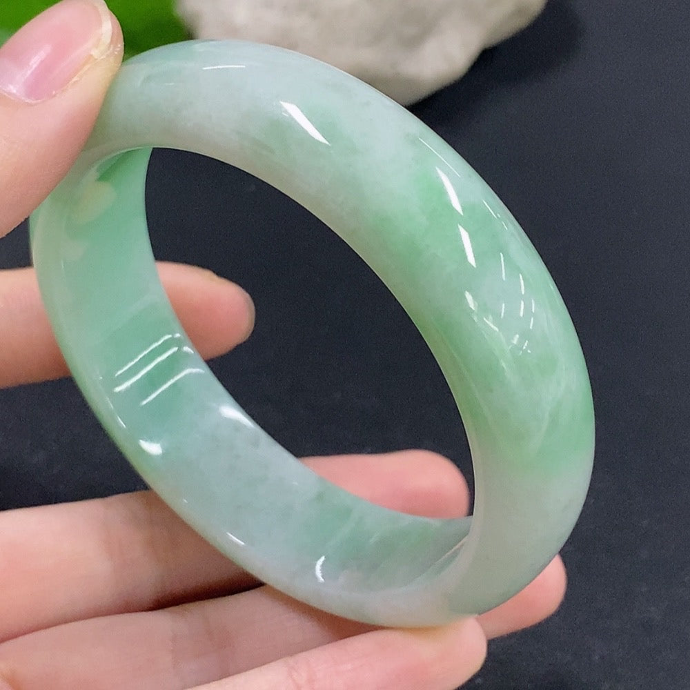 Jadeite round bracelet with size 58.8, approx. 74.38g, featuring smooth green jade beads on a delicate string.