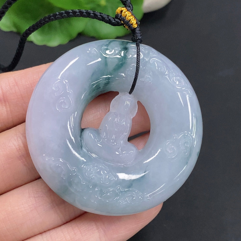 Huiliu Jadeite Enlightenment Pendant featuring polished jade with intricate carvings, hanging from a silk cord.