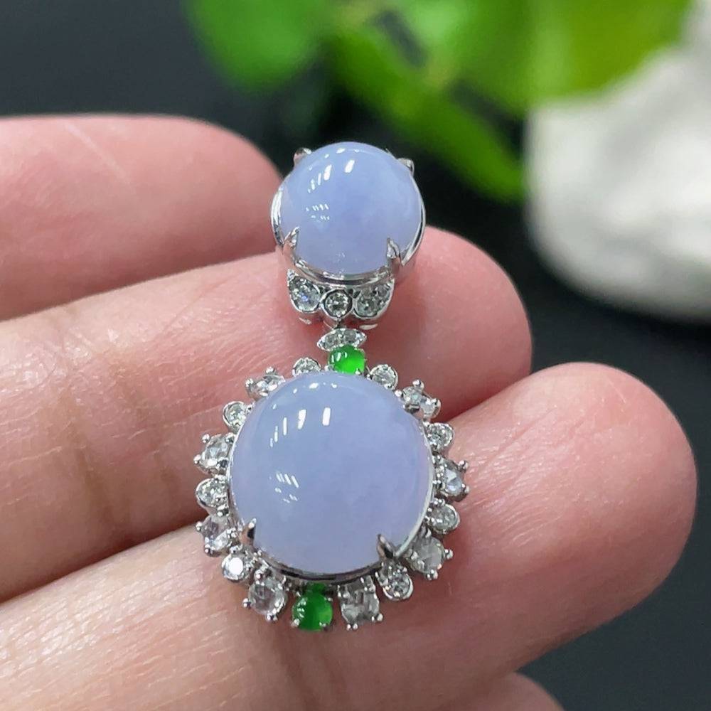 Jadeite cabochon pendant with 18K gold and diamond accents, showcasing a polished green jade stone and intricate gold detailing.