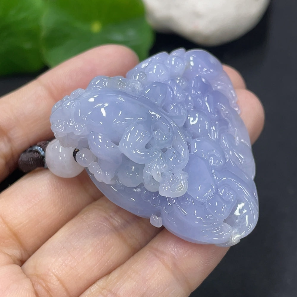 Huiliu certified jadeite pendant featuring a smooth, polished green jade stone on a delicate cord.