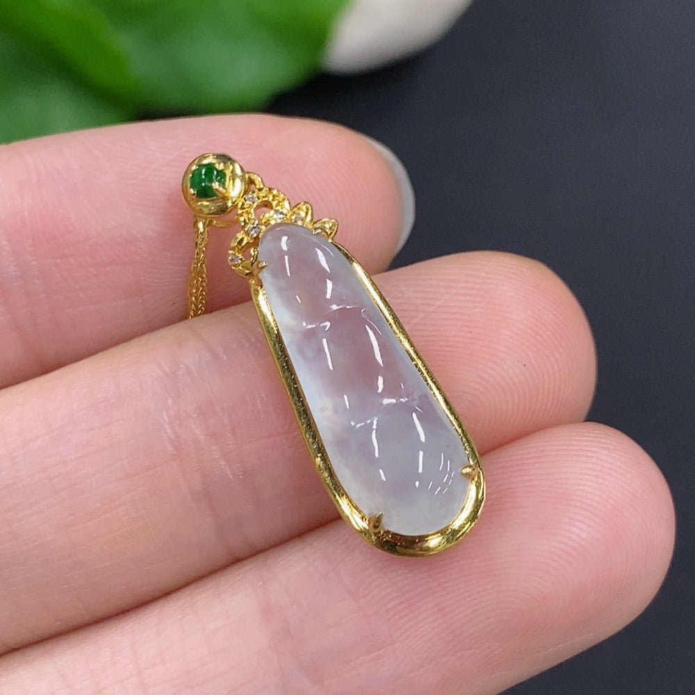 Huiliu Jadeite Auspicious Bean Pendant set with diamond accents on chain, featuring a polished jade pendant in a natural outdoor setting.