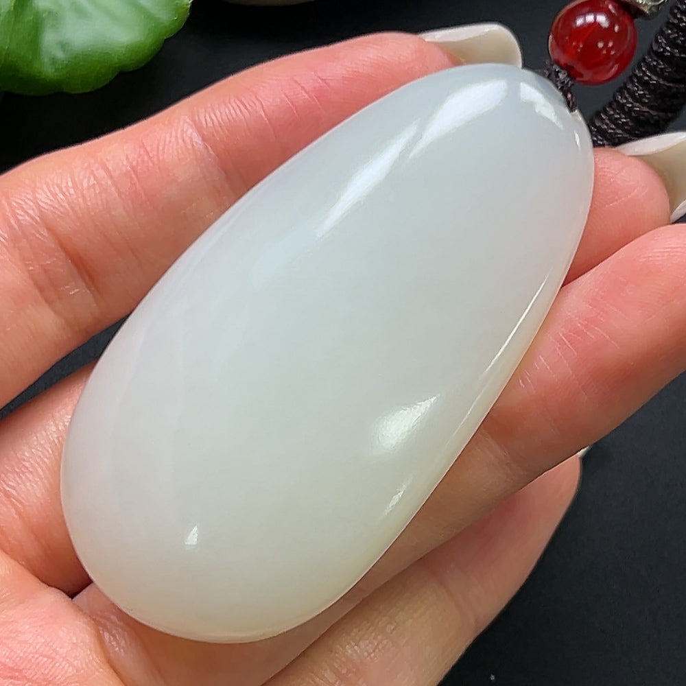 Hetian Jade plain pendant with rope necklace, HKHQ brand, showcasing smooth, polished jade in a simple, elegant design.
