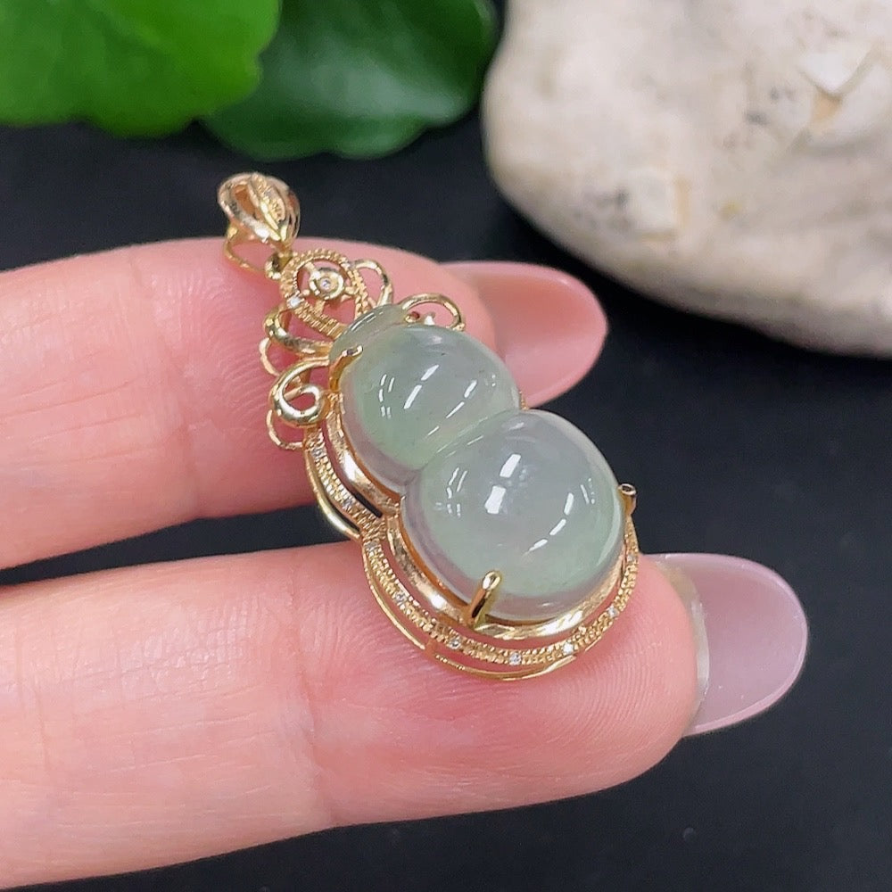 Jadeite gourd pendant by HUILIU HQ with 18K gold and diamond accents, showcasing a polished green jade pendant on a chain.