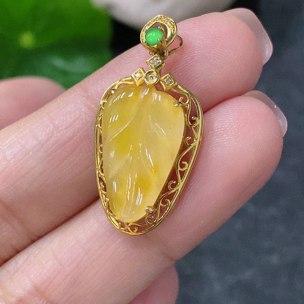 Huiliu jadeite leaf pendant with diamond accents, featuring yellow-colored inlays on a delicate jade pendant.