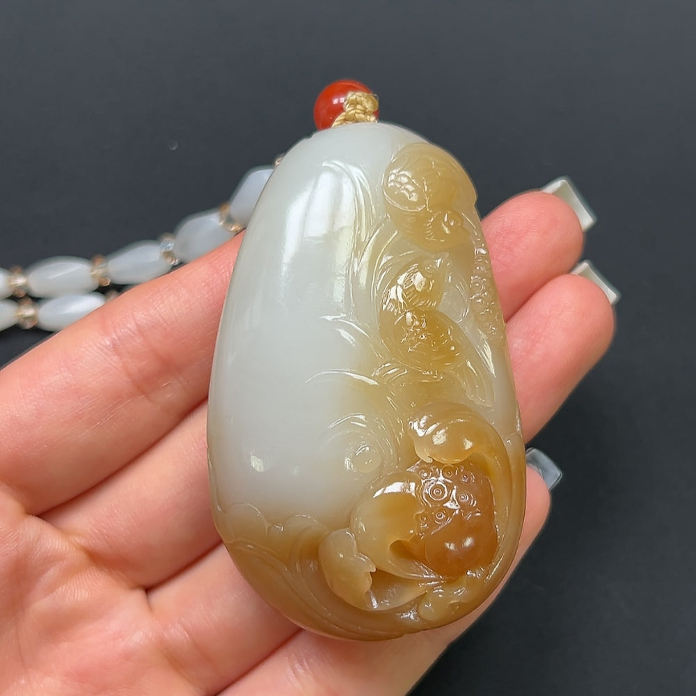 Hetian Jade "Joy on the Brow" pendant necklace with non-Hetian beads, featuring a polished jade pendant and decorative beads.