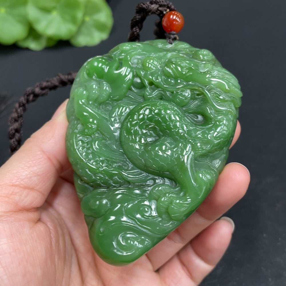 Huiliu HQ Hetian Jade hand-carved dragon pendant featuring bi jade, showcasing detailed craftsmanship and vibrant green color.