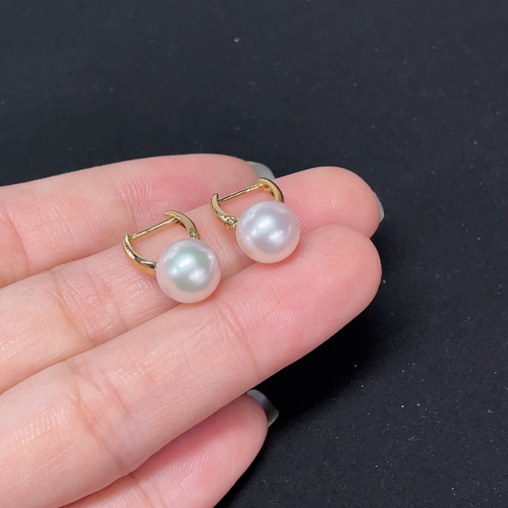 Saltwater pearl earrings with 18K gold hooks, elegant jewelry by HKHQ featuring lustrous pearls and gold accents.