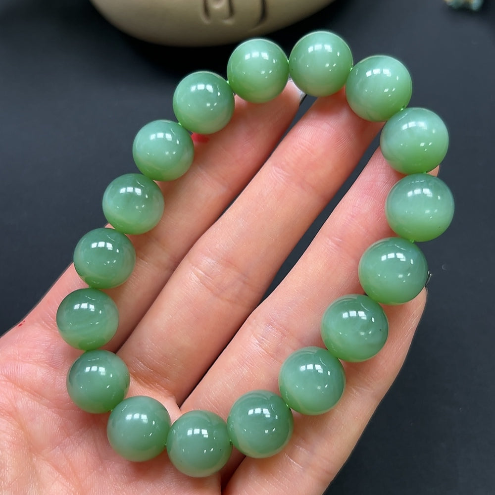 Hetian jade bracelet with 12mm beads and a total weight of approximately 45.9g, featuring smooth, polished jade stones.