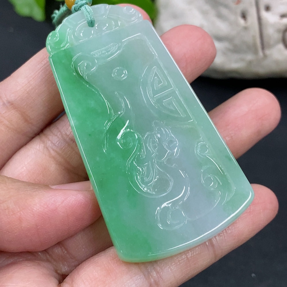 Antique jadeite pendant weighing approximately 32g, featured on a necklace, from HKHQ with intricate design details.