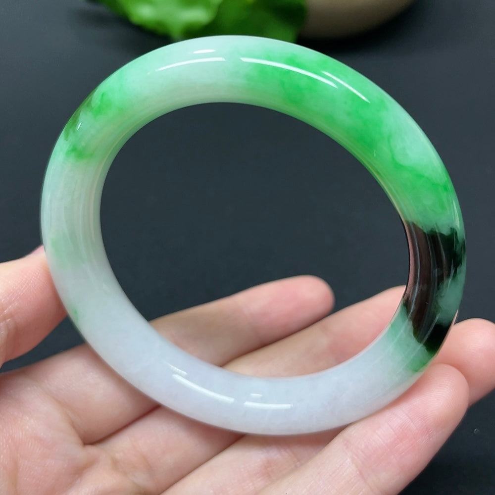 HKHQ jadeite round bangle in size 52.5 with a 51.35g weight, showcasing smooth, polished jadeite surface and rounded shape.