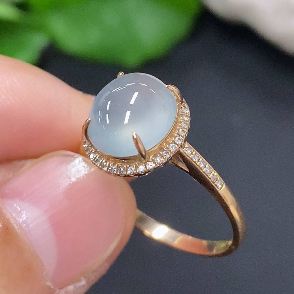 Huiliu Jadeite cabochon ring with diamond accents, featuring a polished green jade gemstone and silver band.