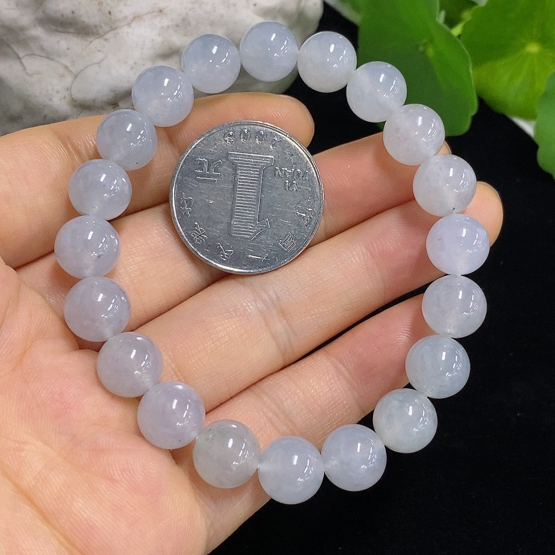 Jadeite bracelet with 9.6mm beads, weighing approximately 31.93g, featuring smooth, polished jadeite stones on a delicate bracelet.